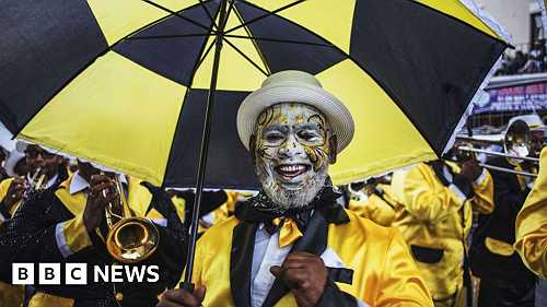Africa's top shots: Faith, fishing and fashionable hats