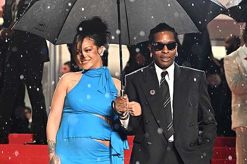 Rihanna & A$AP Rocky Posing In The Rain Is One Of The Most Iconic Moments We’ve Seen This Year